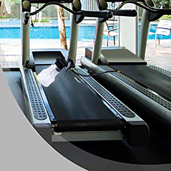 5ltr Treadmill Silicone Oil being applied to a Treadmill Belt